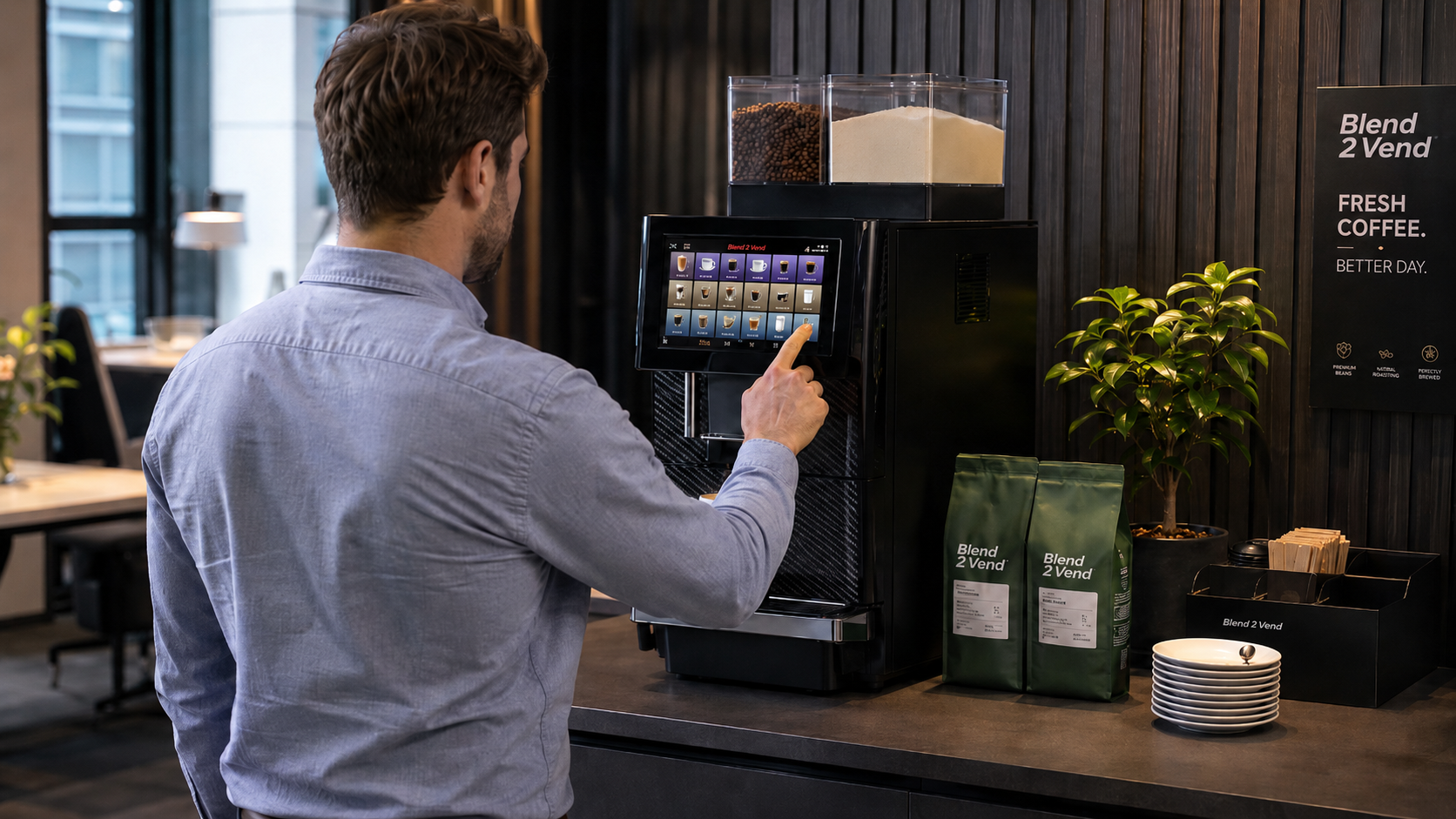 A team member using a Blend 2 Vend bean-to-cup coffee machine in a modern office as part of a fully managed service