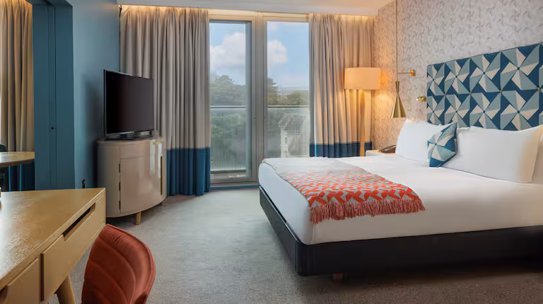 A modern, tastefully furnished hotel guest room